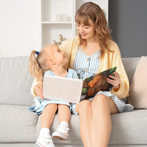 A Young Nanny smiling with a girl